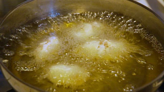 Fish fry in hot oil in a pan