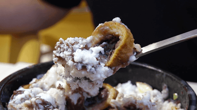 Spoon full of red bean shaved ice dessert