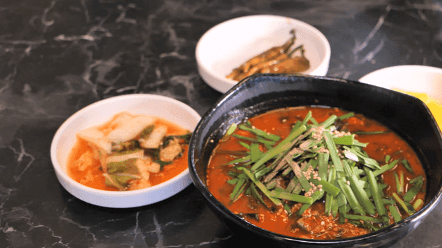 Sundubu Jjamppong and side dishes on table