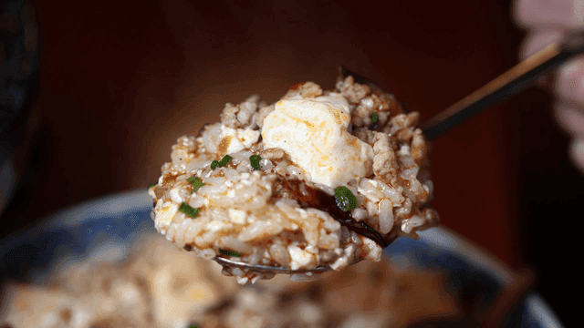 Spoonful of rice mixed with Mapo Tofu