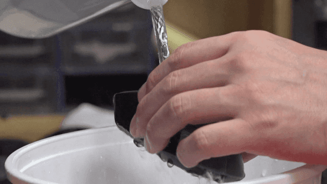 Cleaning solution poured onto a computer mouse