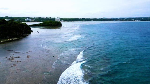 Waves Crashing Near the Shore on a Sunny Day