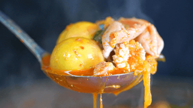 Spicy chicken offal soup with eggs and chicken meat