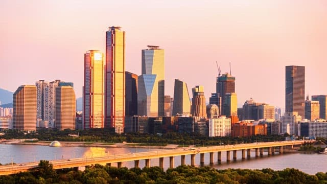 City skyline transitioning from day to night