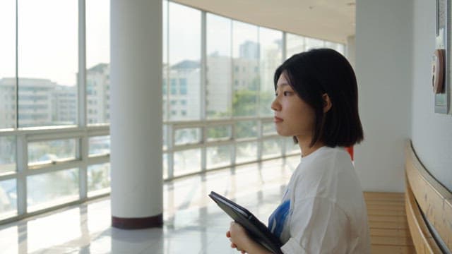 Woman sitting on bench indoors