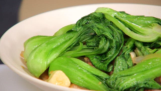 Stir-fried fresh bok choy in a white bowl