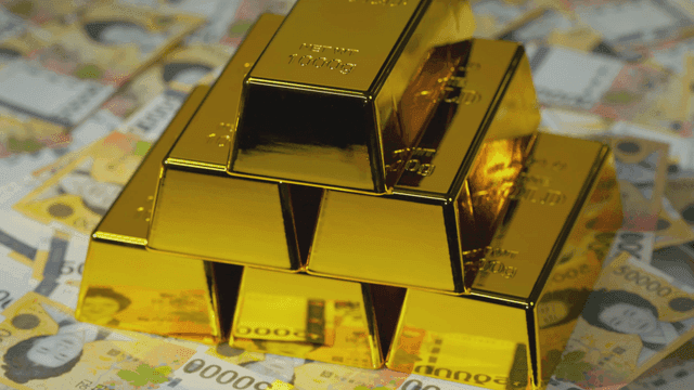 한국 화폐 위에 쌓인 금괴