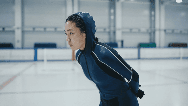 Focused skater practicing on ice rink