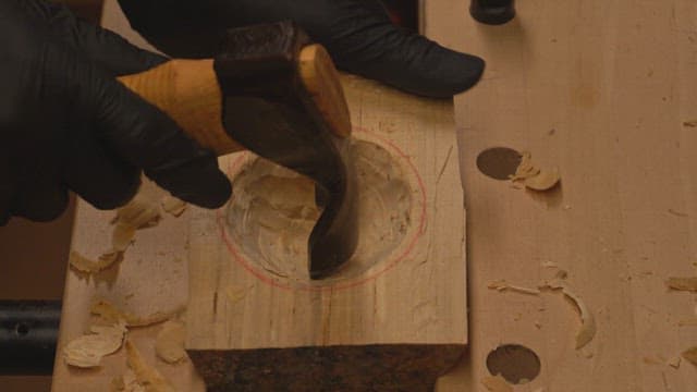 Wood carving with a curved chisel