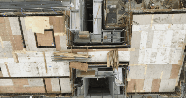 Construction site with workers and materials