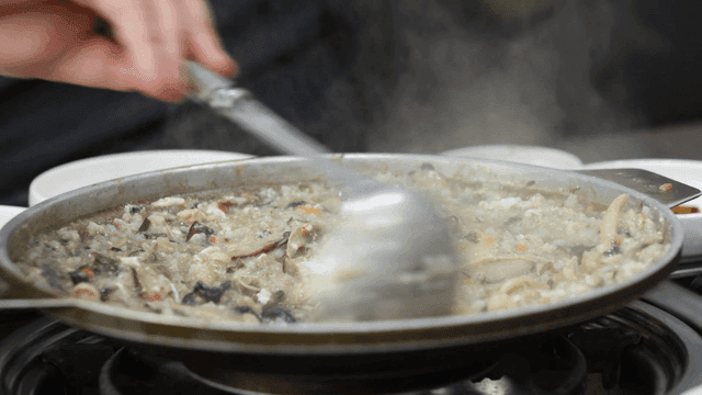 Ladle for stirring hot porridge in pan