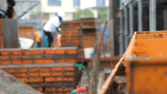 Construction site with workers and materials