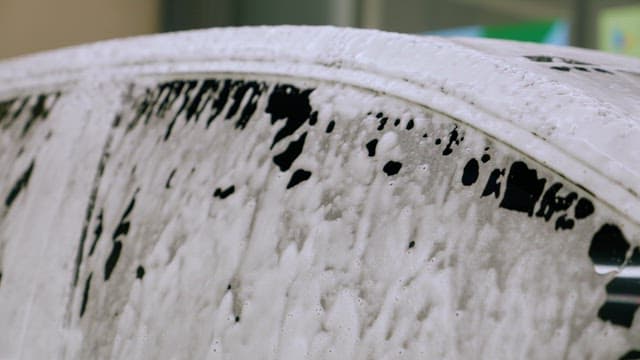 Car Covered in Soapy Water Waiting to be Washed