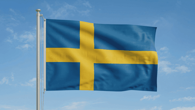 Swedish flag waving against a clear sky