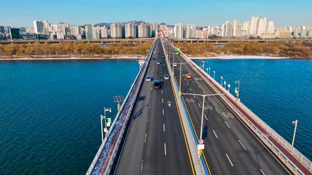 Vehicles Running on a Bridge to Cross the Han River