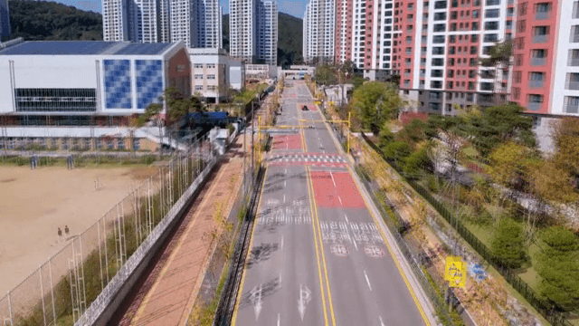 Quiet city road with tall buildings
