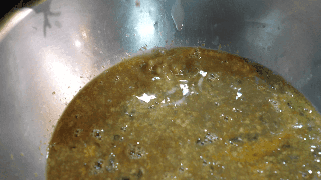 Crab innards being prepared in a bowl