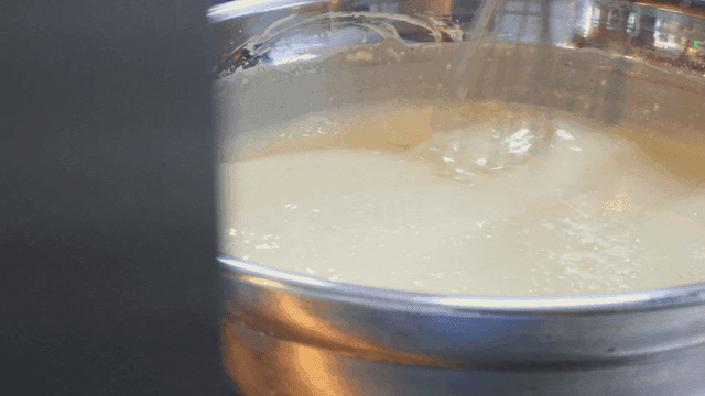 Mixing batter in a large metal bowl