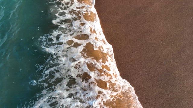 Waves gently lapping on a sandy beach