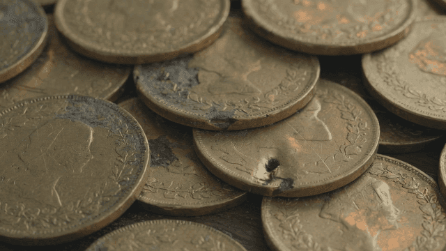 Piles of scratched coins