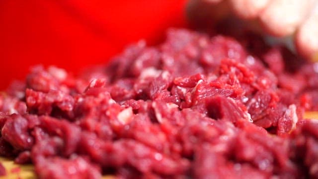 Freshly chopped beef on a cutting board