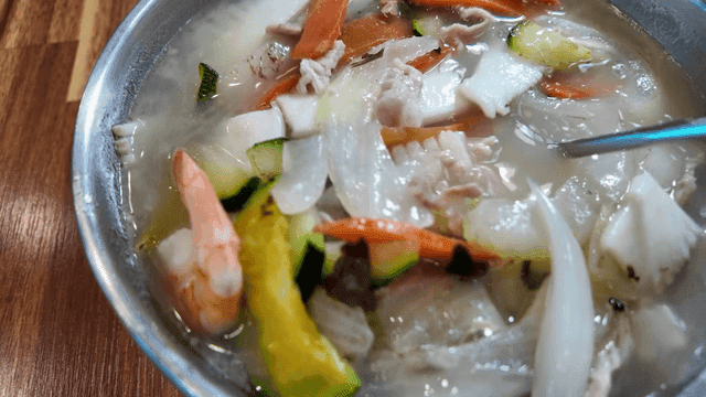 Jjamppong soft tofu stirred with spoon