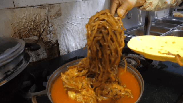 Pork backbone stew with sweet potato stems on top