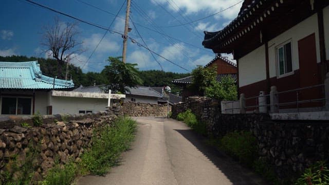 Village alley with traditional houses on a sunny day