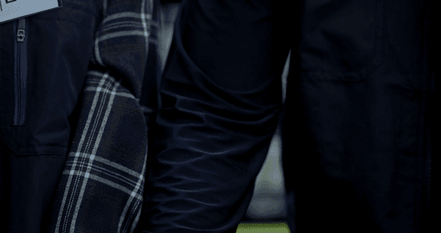 Convenience store manager holding part-timer's hand