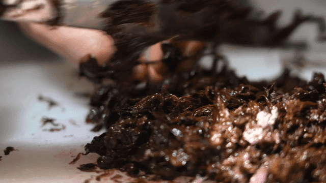 Chopping seaweed on a cutting board