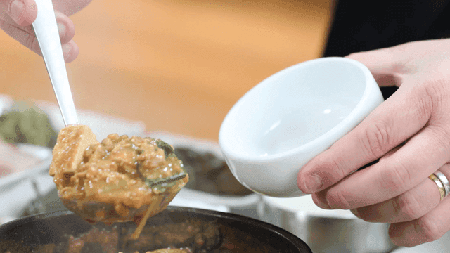 Meal of hot soybean paste stew served in bowl