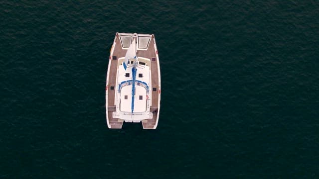 Boat Sailing Leisurely on Vast Ocean