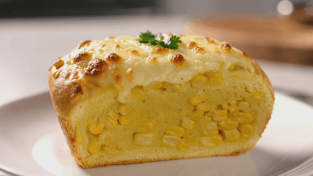 Cheesy corn bread on a white plate