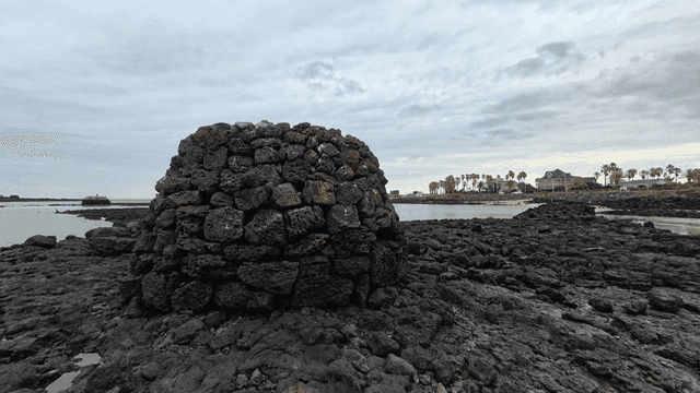 Rocky beach with a stone structure