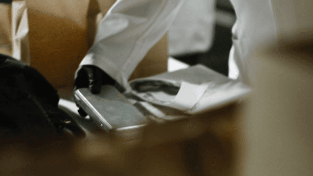 Investigators handling evidence carefully