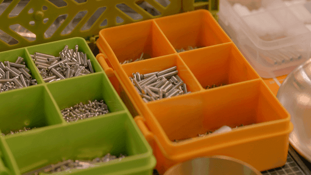 Organized metal screws in storage boxes