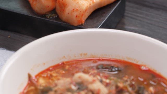 Spoon of Spicy and Hot Korean Thistle Stew with Pork