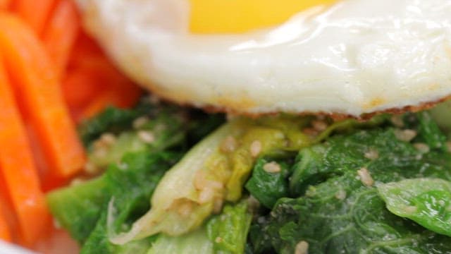 Fresh bibimbap with fresh vegetables and fried egg