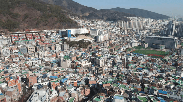 Wide cityscape at foot of mountain