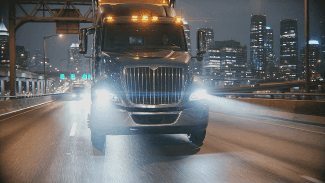 Cargo trucks driving on city highway
