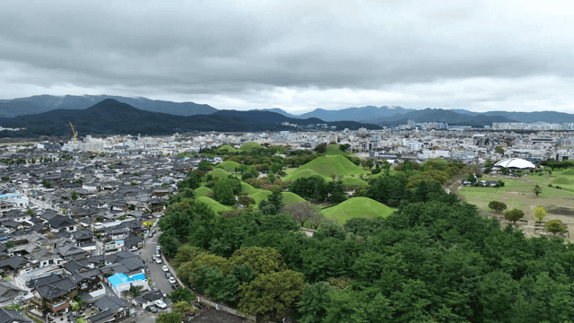 Hanok village with green royal tombs