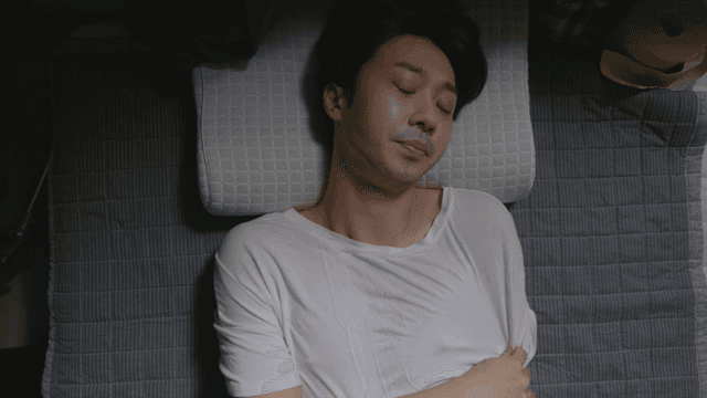 Man sleeping peacefully indoors