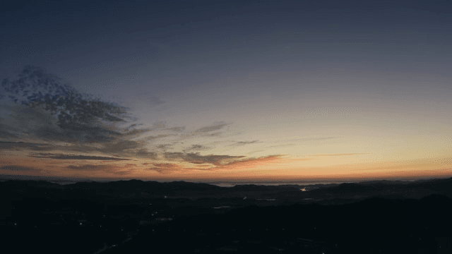 Sunset over a vast mountain range
