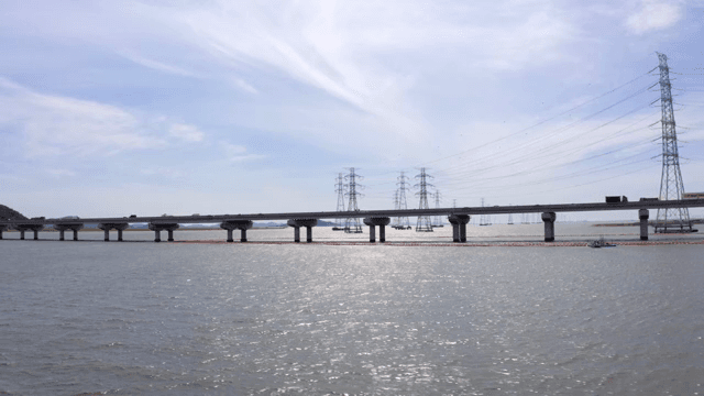 Bridge and cars over the blue river