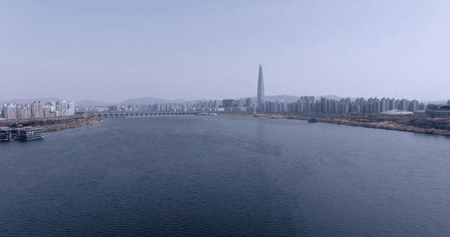 A wide river with a city skyline