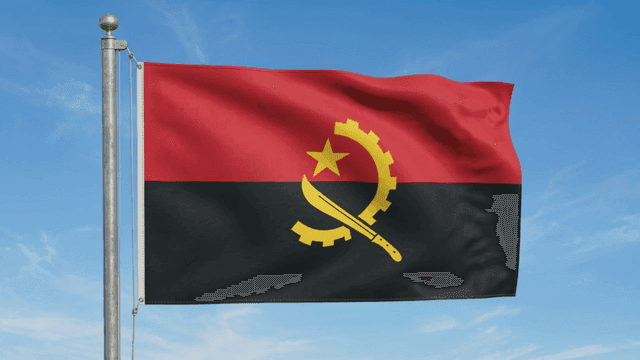Angolan flag fluttering under clear sky
