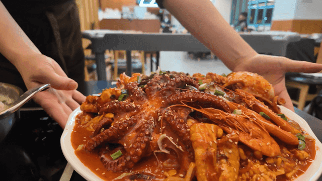 Plate of spicy seafood stew at restaurant
