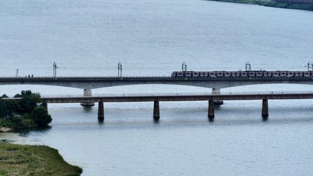 Subway crossing a bridge over a river