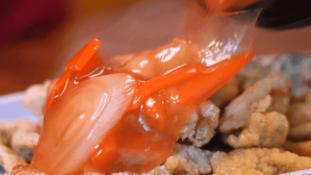 Sweet and sour sauce poured over fried pork