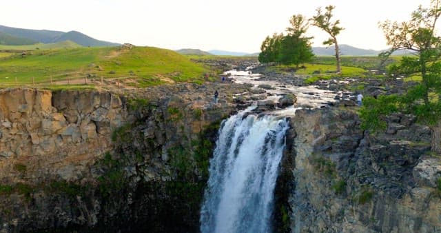 Scenic waterfall in a lush green landscape